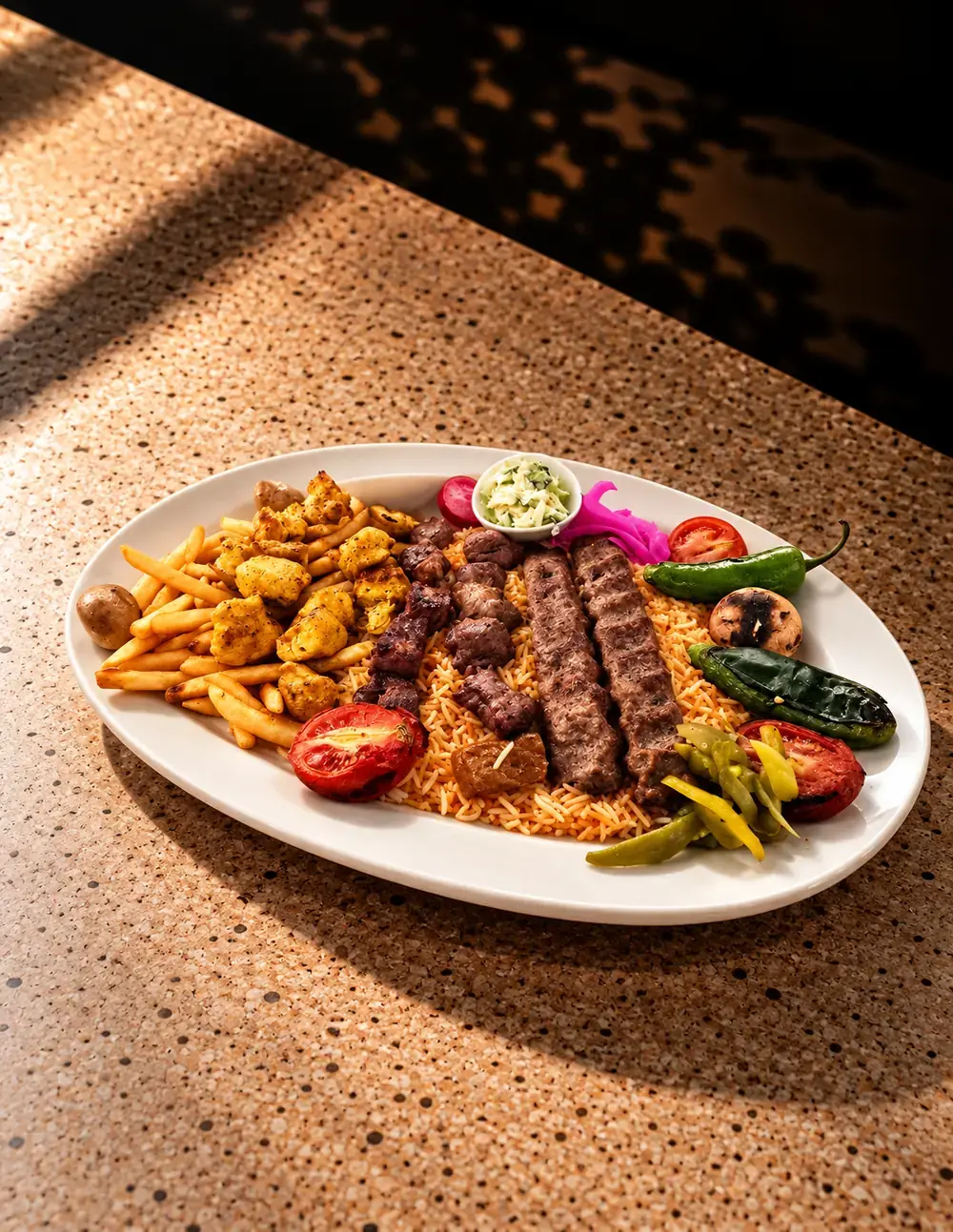 Mixed grill platter with kabab, tawook and fries
